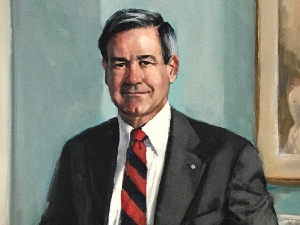 Portrait of Charles Hawkins in front of a blue wall