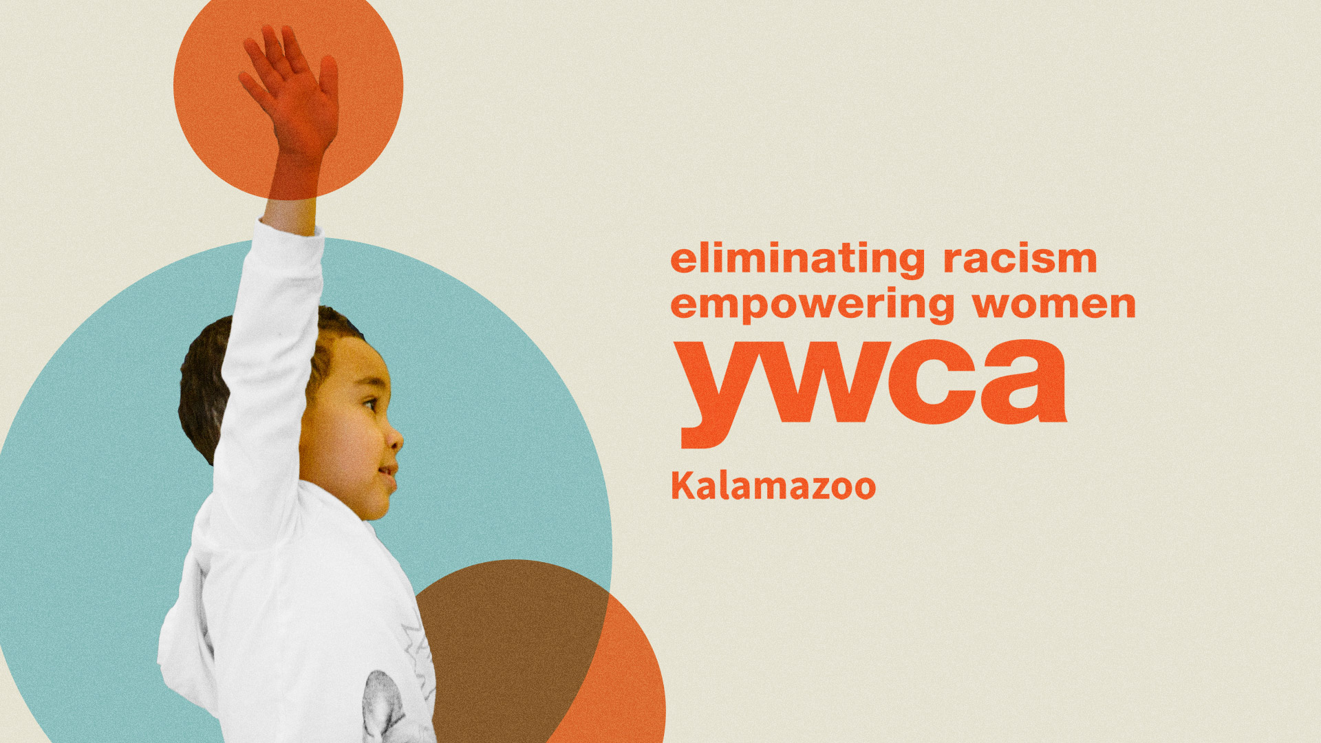 Young boy raising his hand. An orange circle is highlighting his hand. The YWCA Kalamazoo logo with the "eliminating racism, empowering women" tagline above it.